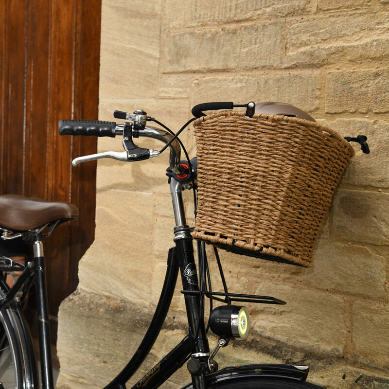 Rattan front basket attached to bicycle