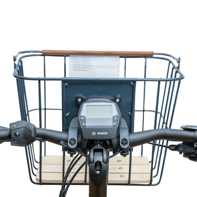 Basket attached to e-bike handlebar with bracket